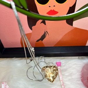 Long necklace with heart pendant